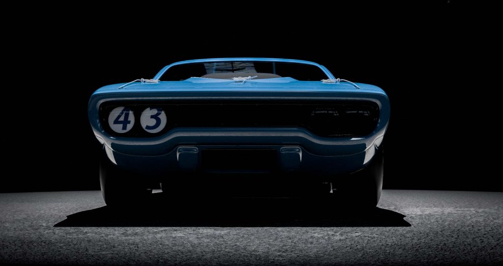A Plymouth GTX rendered in NASCAR style, featuring bold racing liveries and an aggressive stance.
