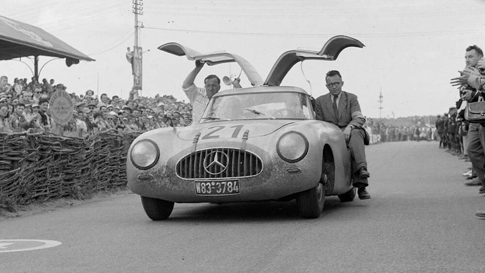 Mercedes-Benz 300SL showcasing its aerodynamic design and iconic gullwing doors, highlighting the innovative engineering that revolutionized automotive performance.